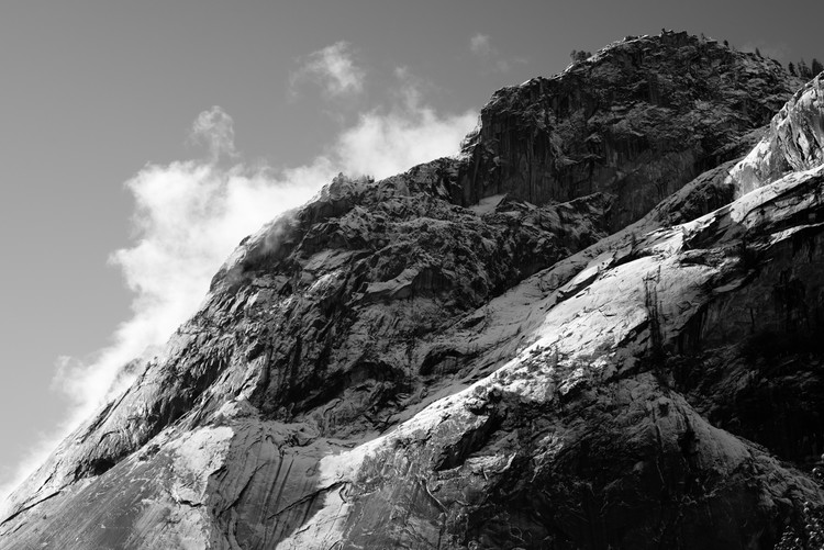 Black and white image of snow capped granite peak in Yosemite