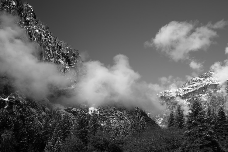 Black and white image of snow capped granite peak in Yosemite