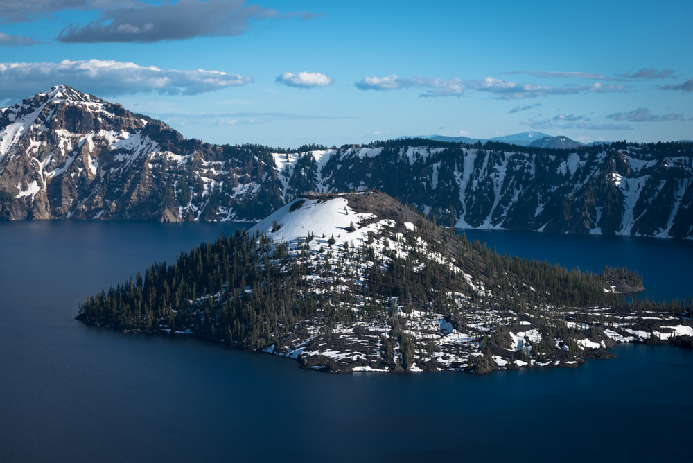 Snow covering the backside of Wizard Island at Crater Lake National Park